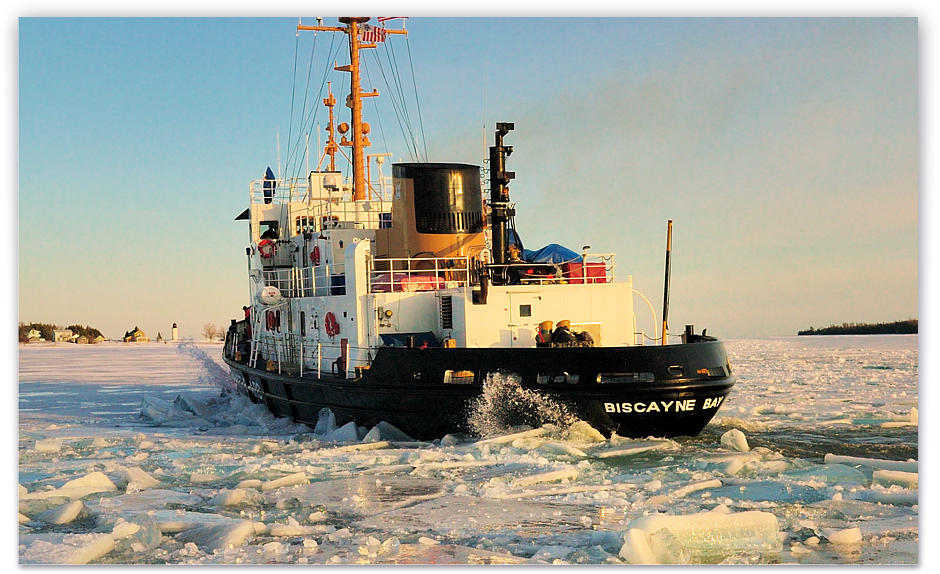 The Biscayne Bay icebreaker making a turn in front of the yacht dock with her bubbler system pushing ice away from the hull