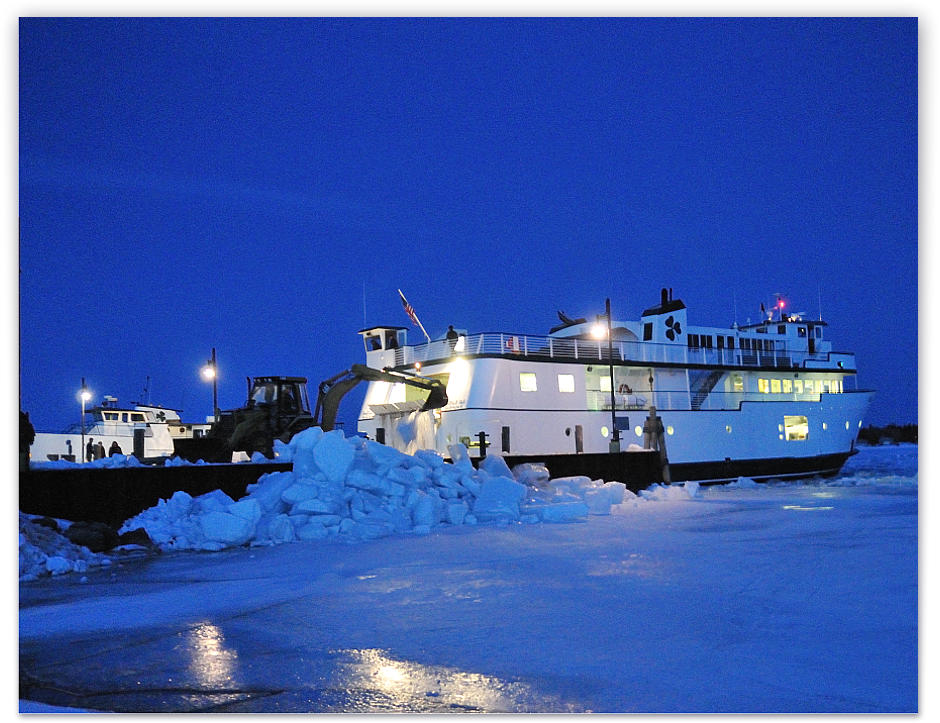 Night approaches as the Emerald Isle backs into her berth after a long day