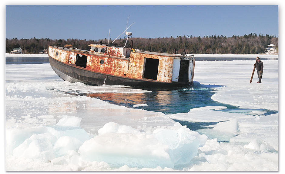 Buddy stands on the ice marking the way for the Ruby Ann when the bow is too high to see forward